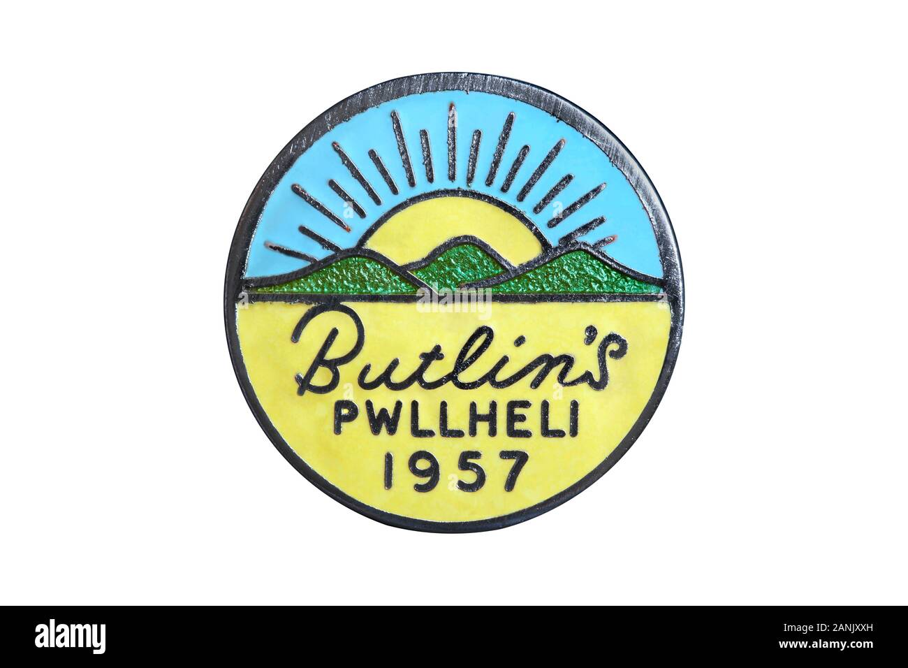 A 1957 badge from the Butlin's Holiday Camp at Pwllheli. Featuring sun, sand and the green hills of North Wales. Stock Photo