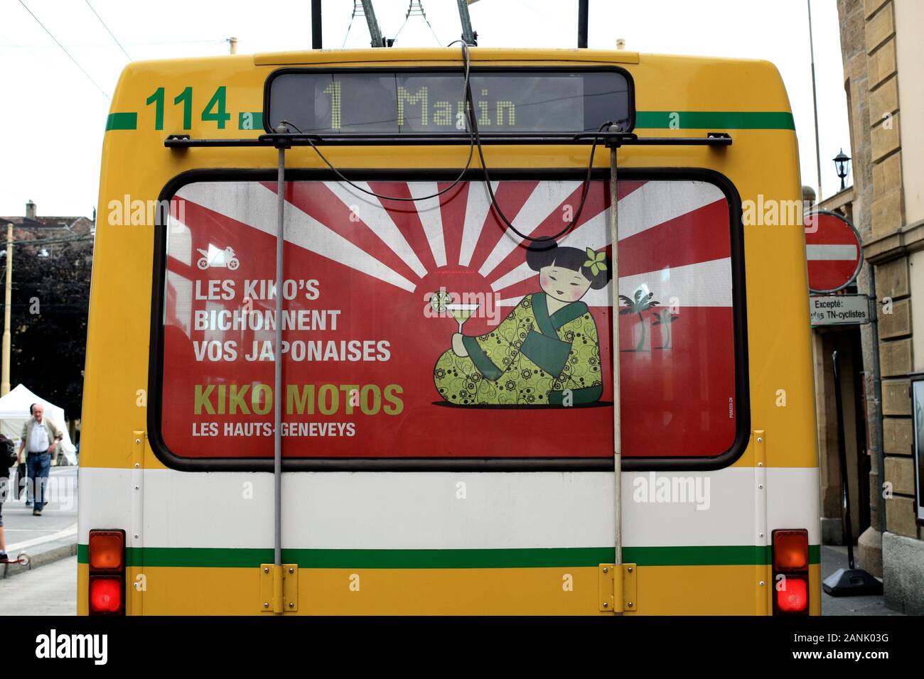 An advert featuring a prominent Japanese-themed rising sun motif on the back of a trolley bus in Neuchatel, Switzerland. Stock Photo