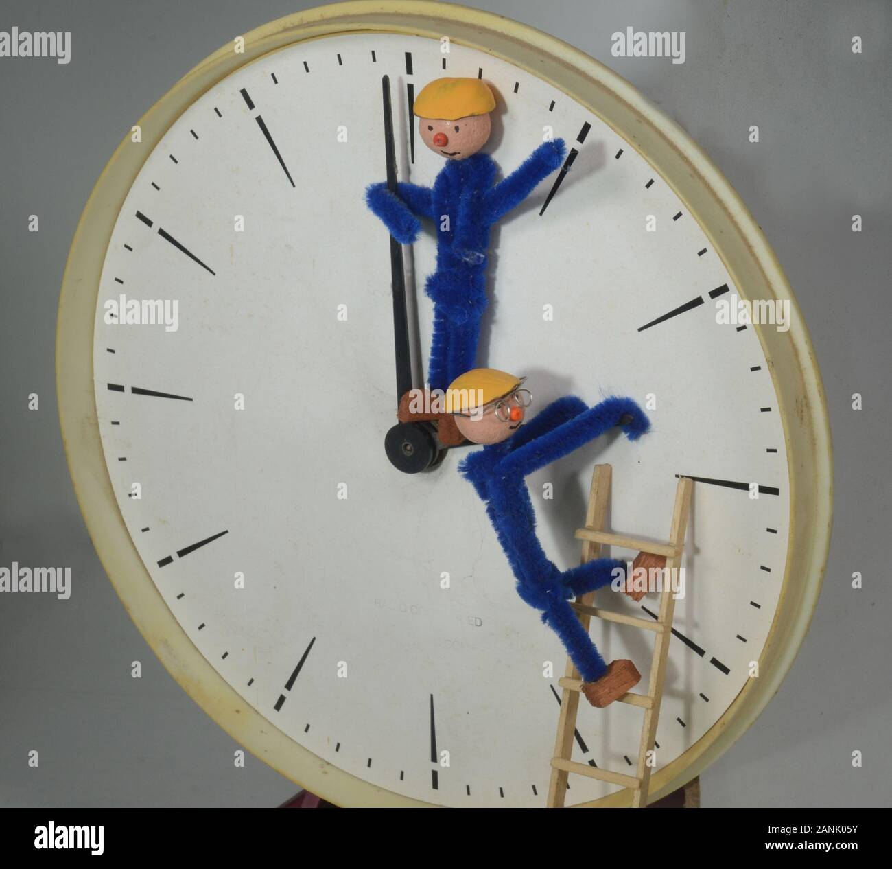 Clockmen adjusting a clock to or back from Daylight Saving Time (DST) Stock Photo