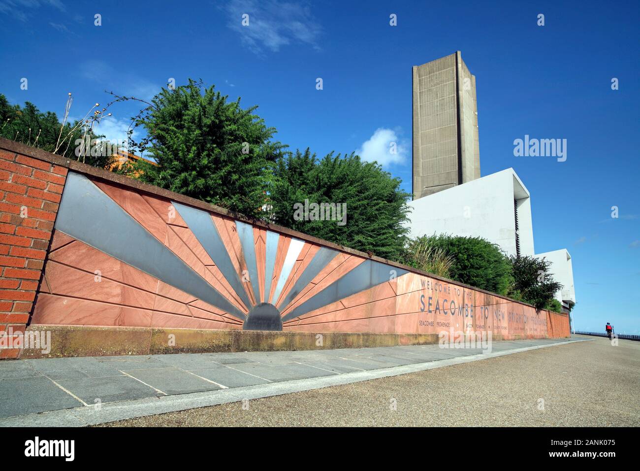 A rising sun motif on Seacombe Promenade by the River Mersey, near Birkenhead, Cheshire. Background: a ventilation tower for the Kingsway Tunnel. Stock Photo
