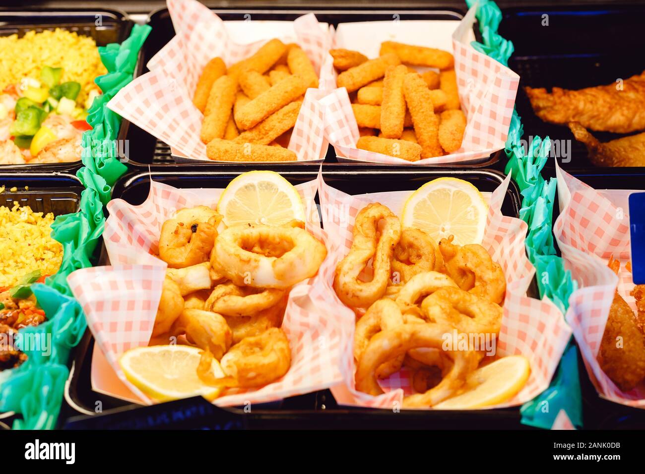 Harmful street food. Squid rings and fish cheese sticks fried breaded