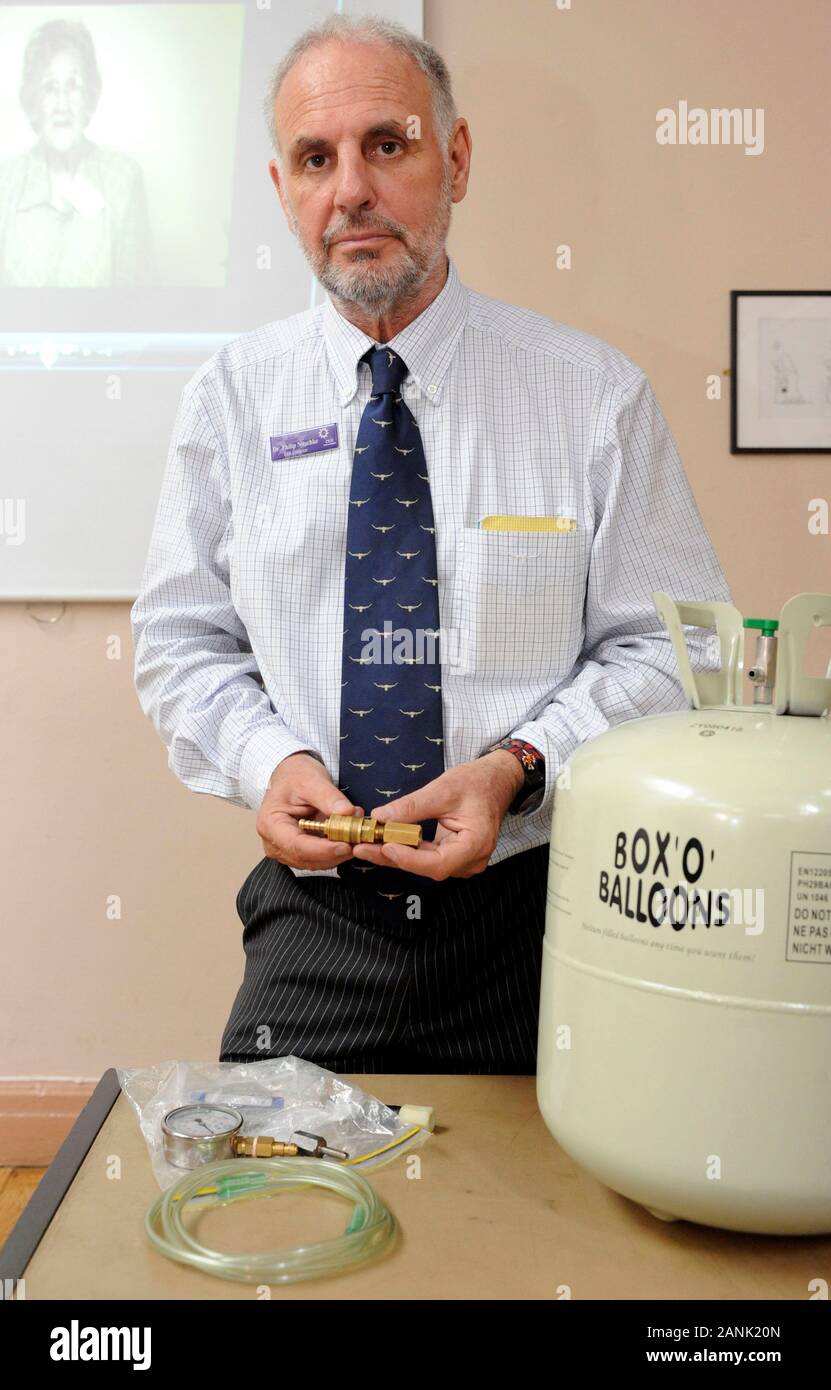 Dr Philip Nitschke director of the pro-euthanasia group Exit International  at a conference in London promoting dying with dignity demonstrating some  of his 'tools', a plastic bag and canister of Helium Gas