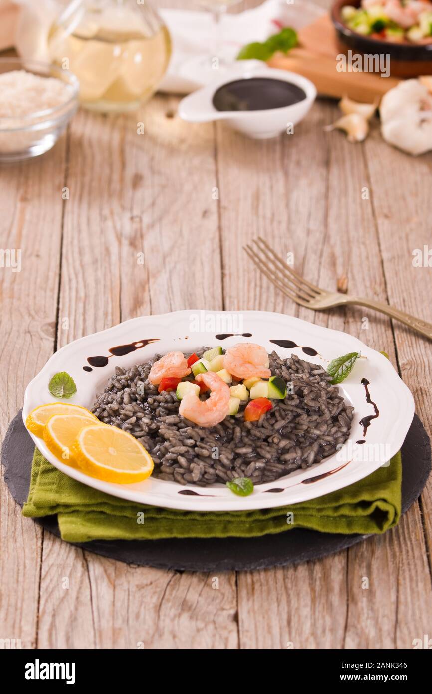 Squid ink risotto Stock Photo - Alamy