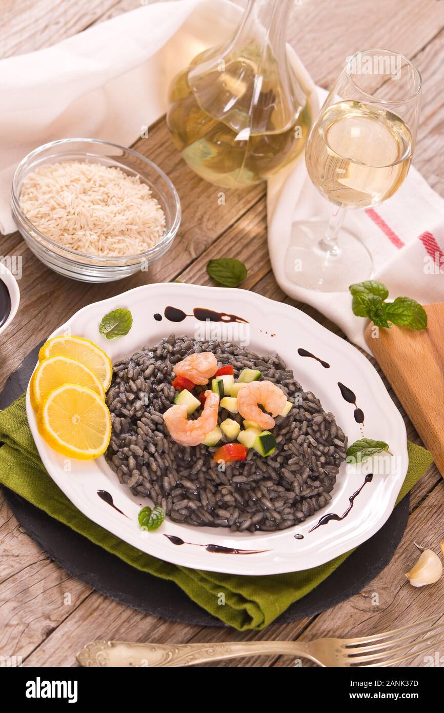 Squid ink risotto Stock Photo - Alamy