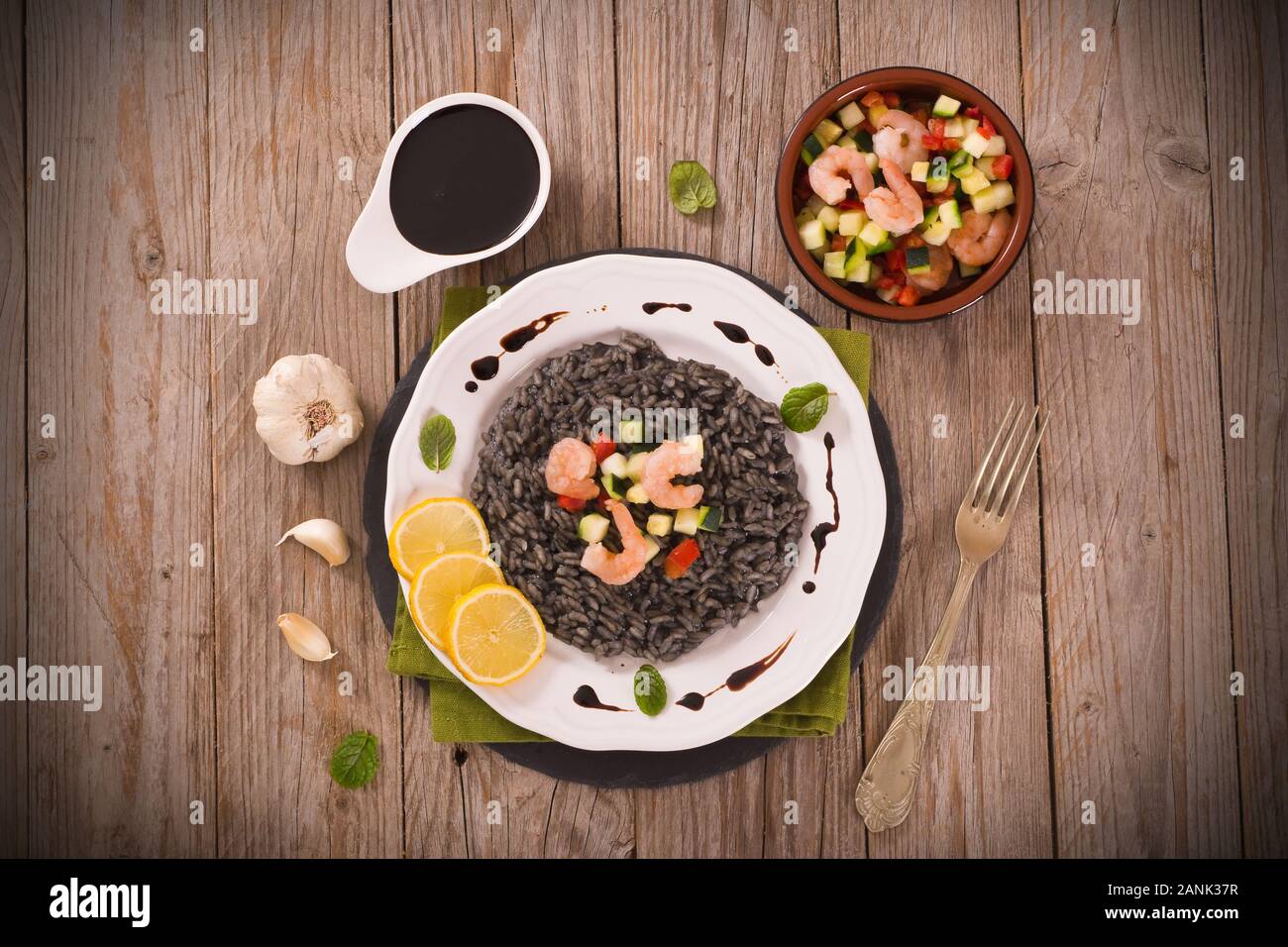 Squid ink risotto Stock Photo Alamy