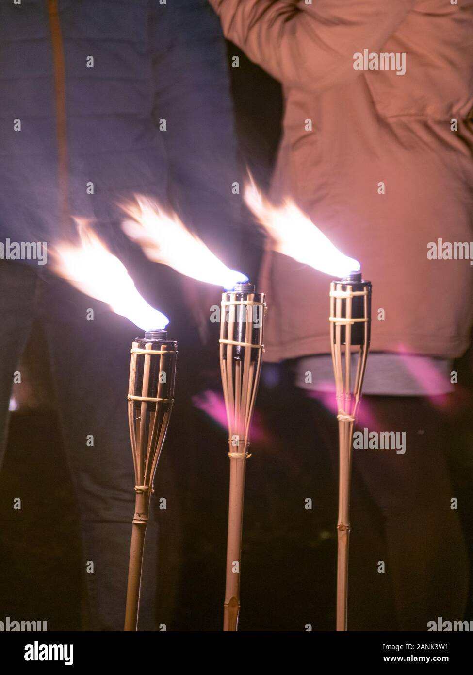 abstract picture with light paintings, three burning torches Stock Photo