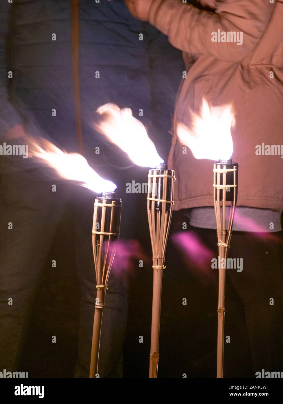 abstract picture with light paintings, three burning torches Stock Photo