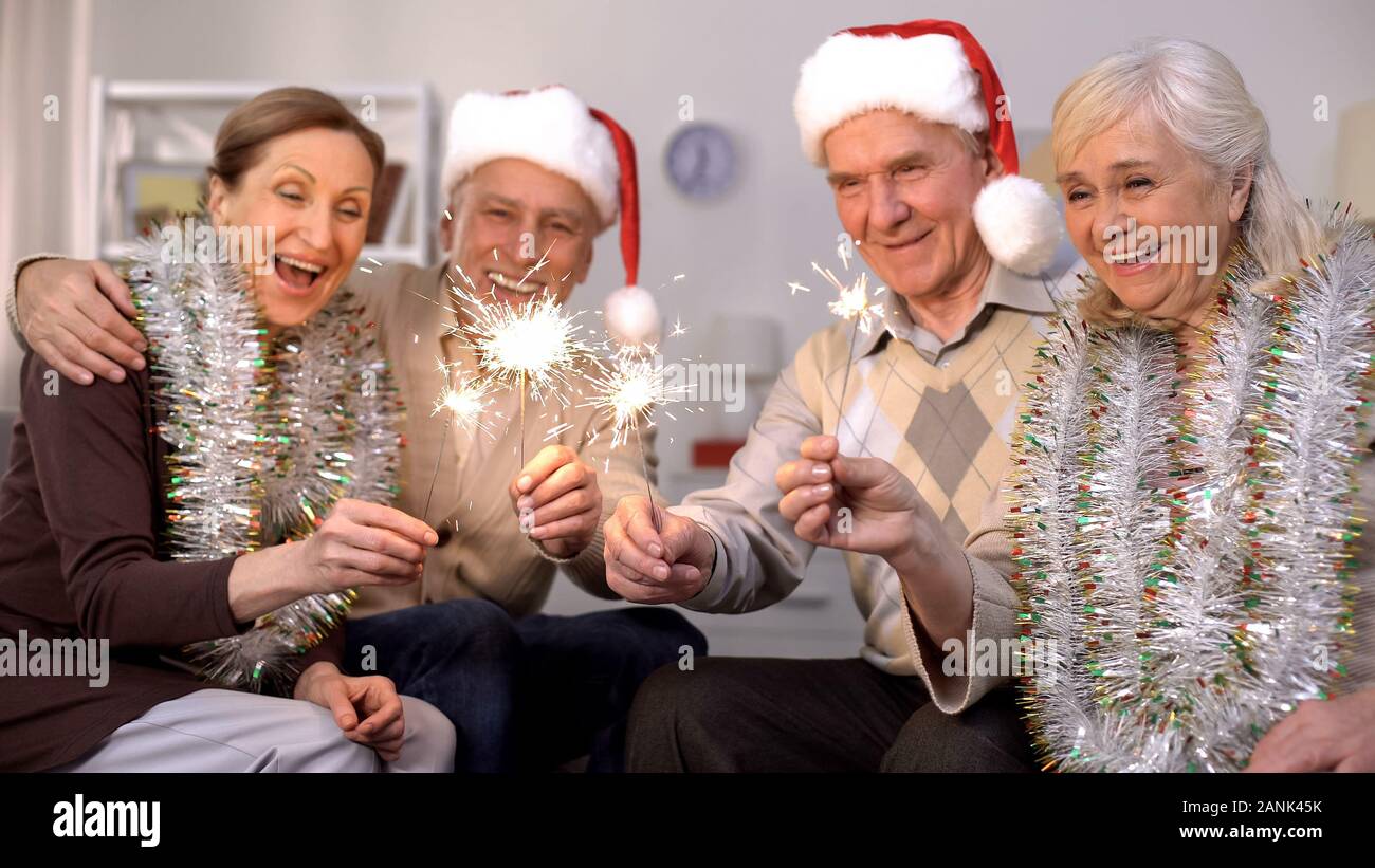 Men in santa hats holding hi-res stock photography and images - Alamy
