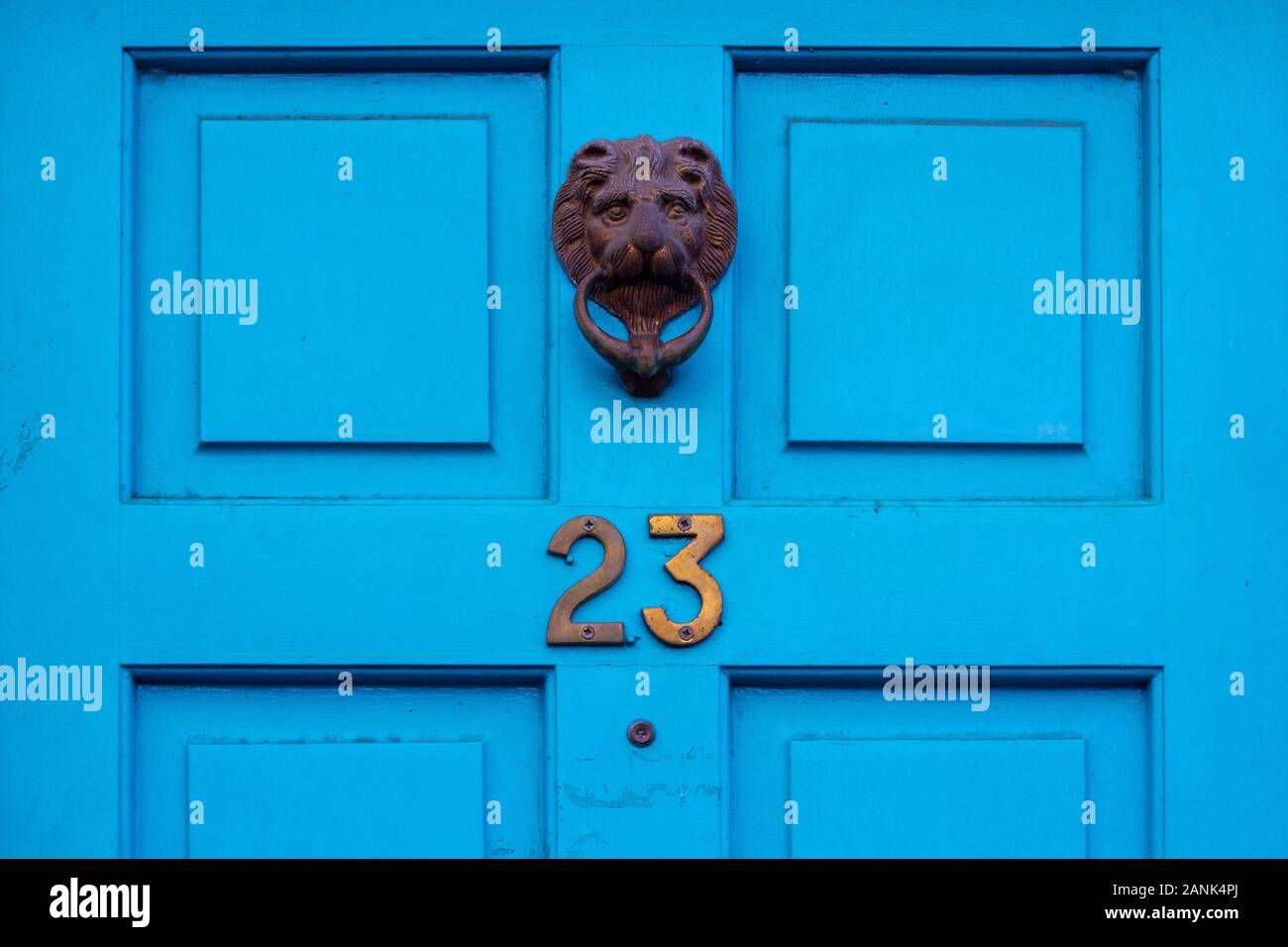 House number 23 with ornate lion's head door knocker Stock Photo