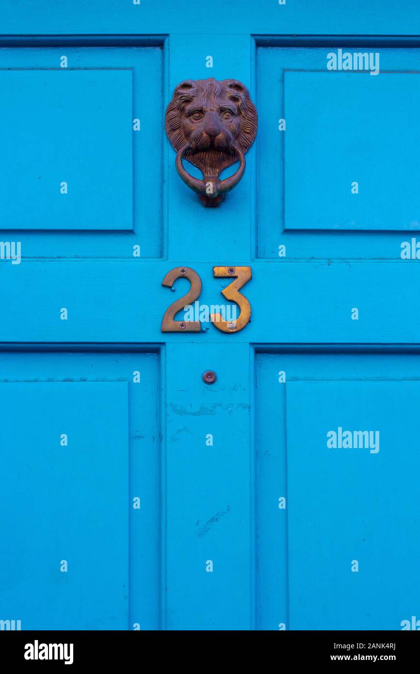House number 23 with ornate lion's head door knocker Stock Photo