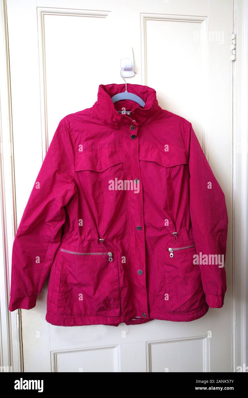 Pink Marks and Spencers Rain Mac Stock Photo