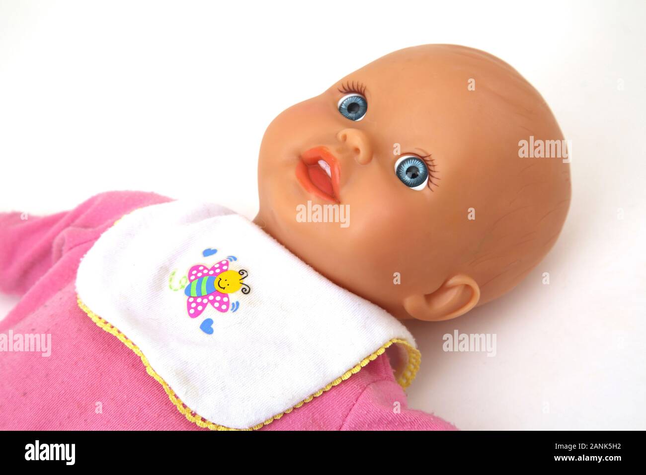 Fisher-Price Soft Body Baby Doll wearing a Babygro and Bib Stock Photo