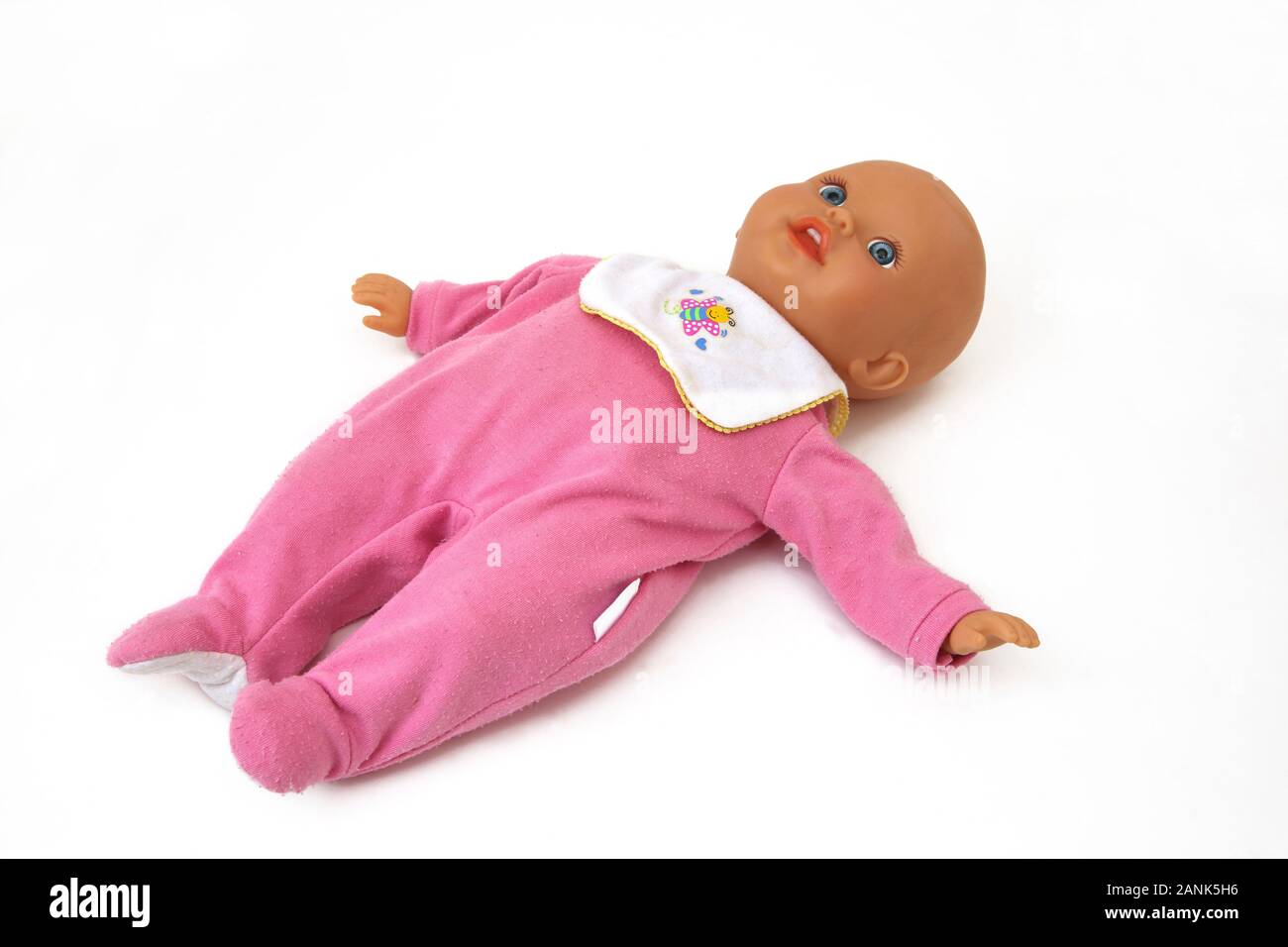 Fisher-Price Soft Body Baby Doll wearing a Babygro and Bib Stock Photo