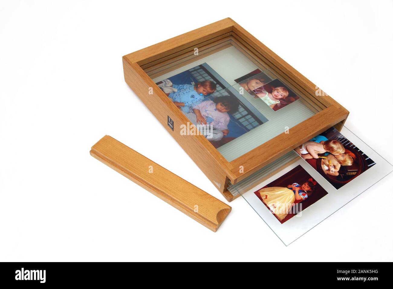 Wooden Picture Frame with Photographs Stock Photo