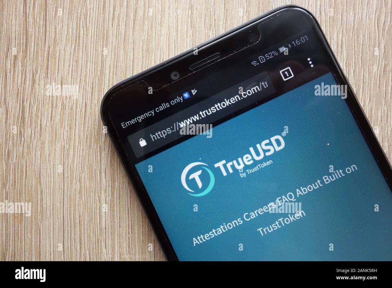 TrueUSD (TUSD) cryptocurrency website displayed on Huawei Y6 2018 smartphone Stock Photo