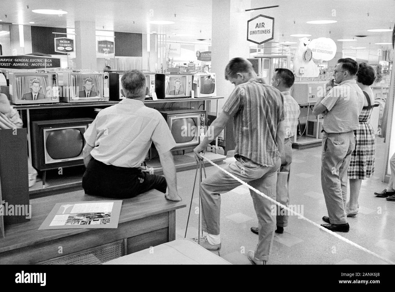 Customers watching U.S. President John F. Kennedy on Televisions, Hecht's Department Store, P.G. Plaza, Hyattsville, Maryland, USA, photograph by Thomas J. O'Halloran, August 1962 Stock Photo