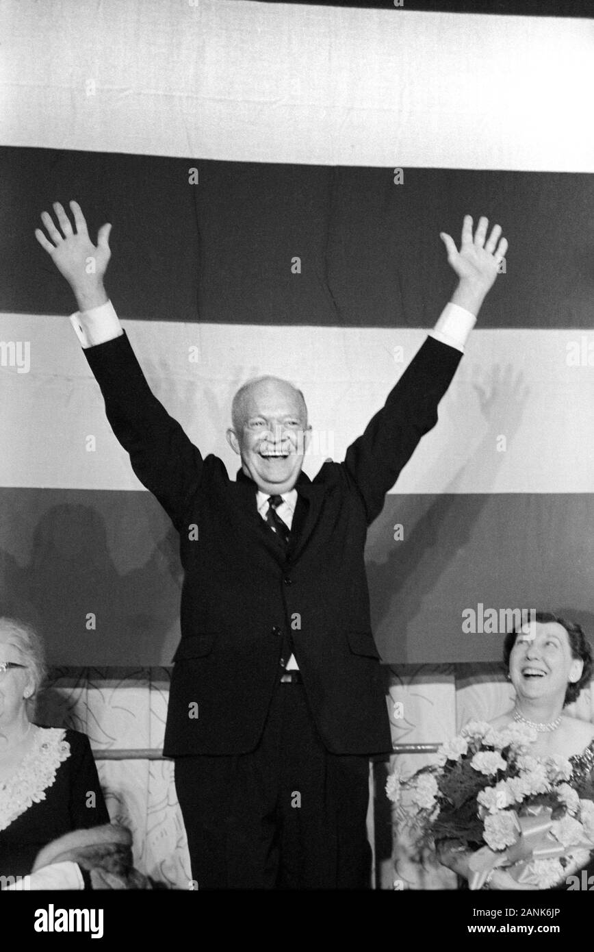 U.S. President Dwight Eisenhower with Raised Arms, First Lady Mamie Eisenhower Looking on, Election Night, November 6, 1956 Stock Photo