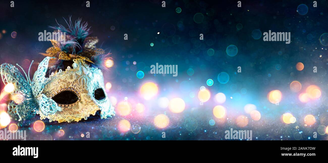 Carnival Mask With Bokeh Lights On Blue Glitter Stock Photo