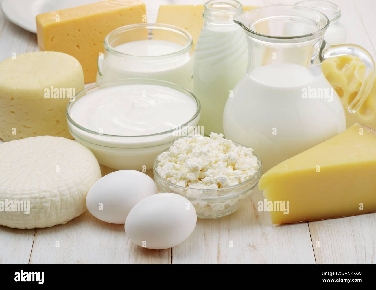 Close up of different dairy products on white wooden background Stock Photo