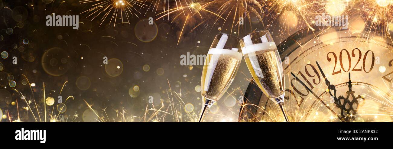 New Year 2020 Midnight With Champagne And Fireworks Stock Photo