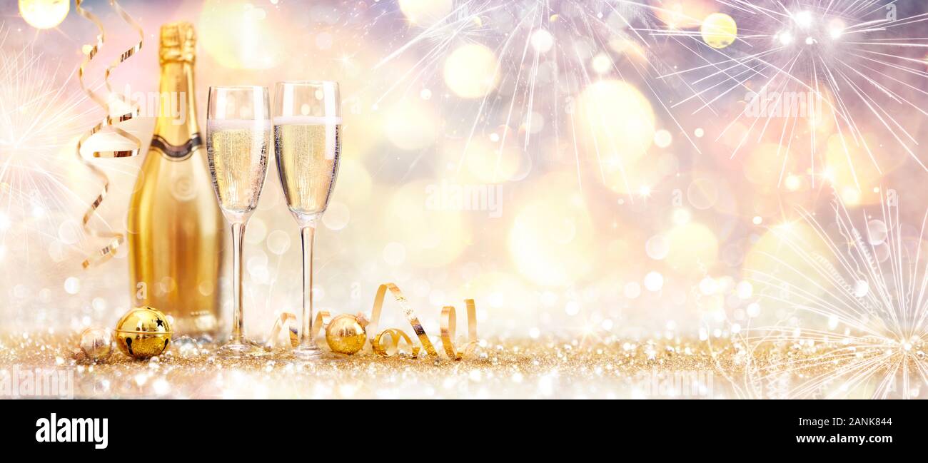 New Year Celebration With Champagne And Fireworks Golden Abstract Background Stock Photo