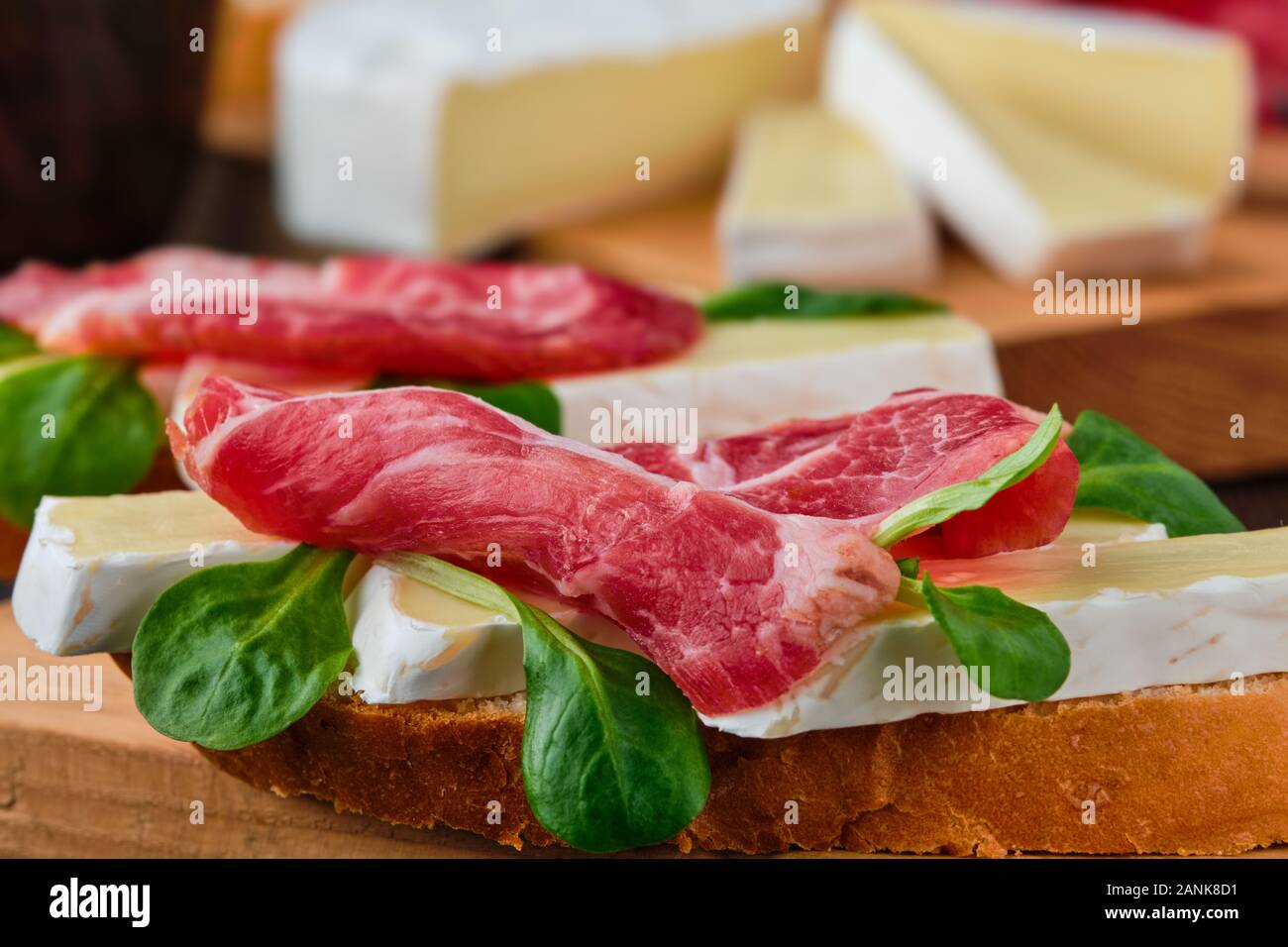 Sandwich with camembert and smoked bacon (macro photo with shallow