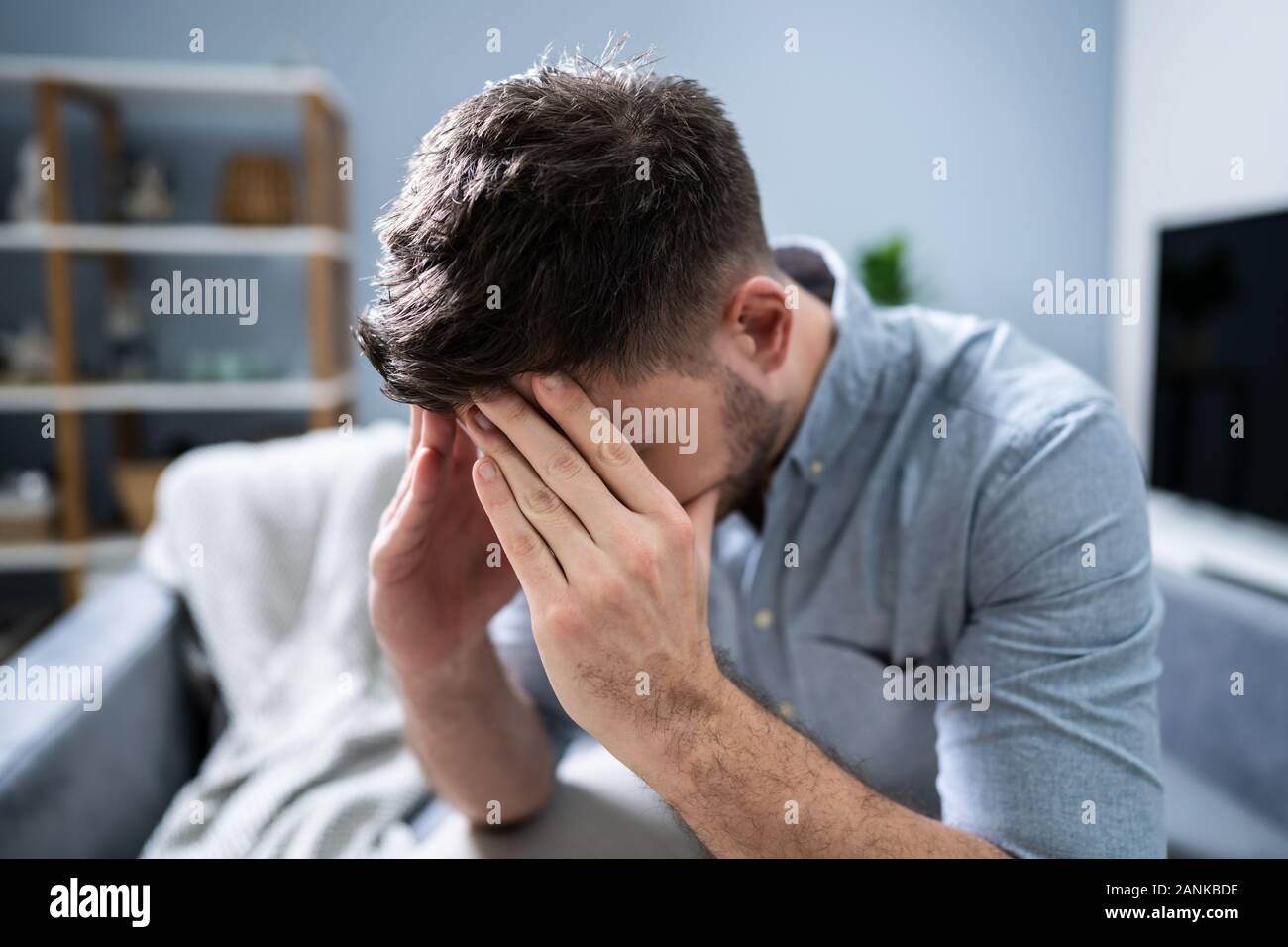 Worried Mid Adult Man Suffering From Headache At Home Stock Photo - Alamy