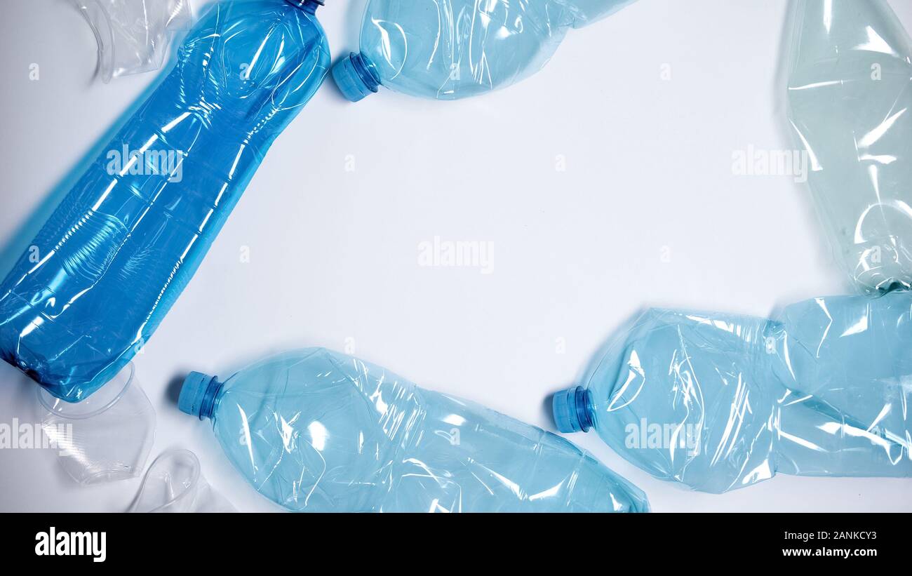 Plastic bottles lying on white background, place for text template, pollution Stock Photo