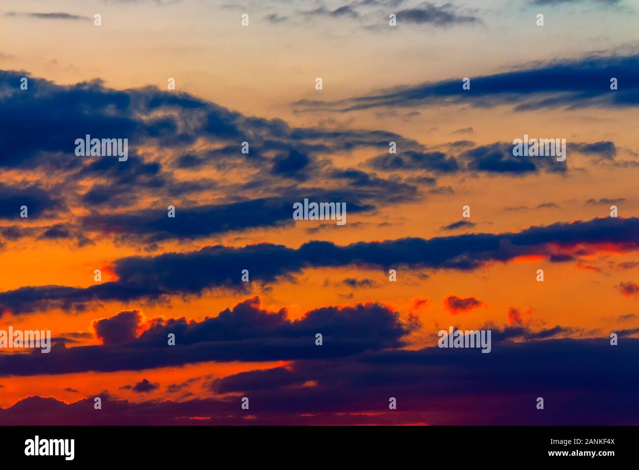 orange sunset sky with clouds. beautiful nature background Stock Photo -  Alamy