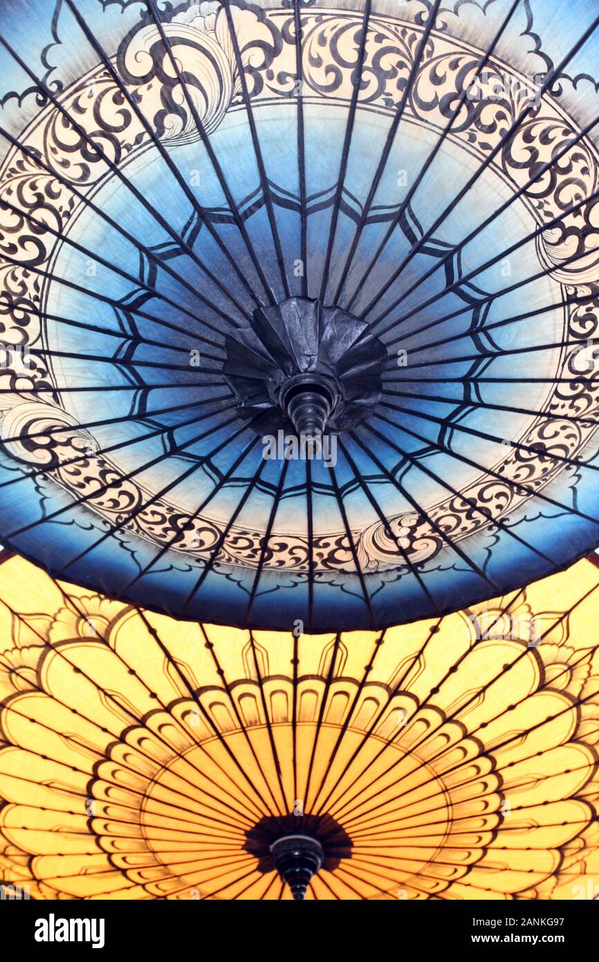 Close up of open blue and yellow Japanese Umbrellas Stock Photo