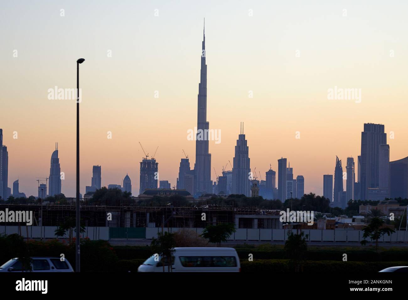 Dubai skyline with Burj Khalifa skyscraper at sunset, clear sky in United Arab Emirates Stock Photo