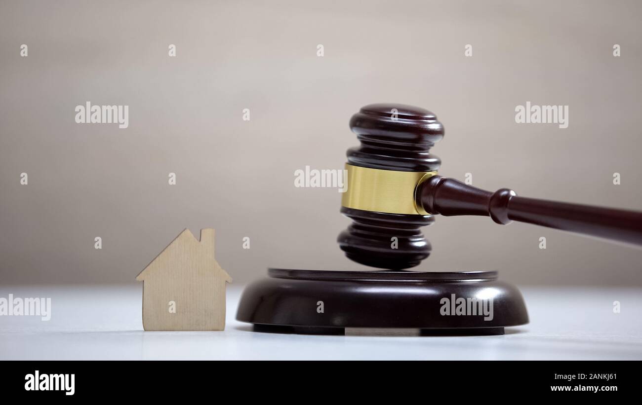 Wooden house sign on table, gavel standing on sound block, private property Stock Photo