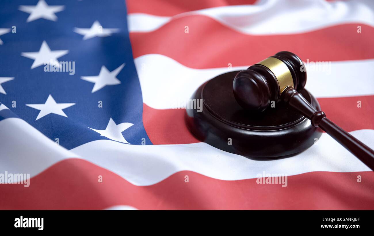 Gavel striking on sound block against american flag, case law, court system Stock Photo