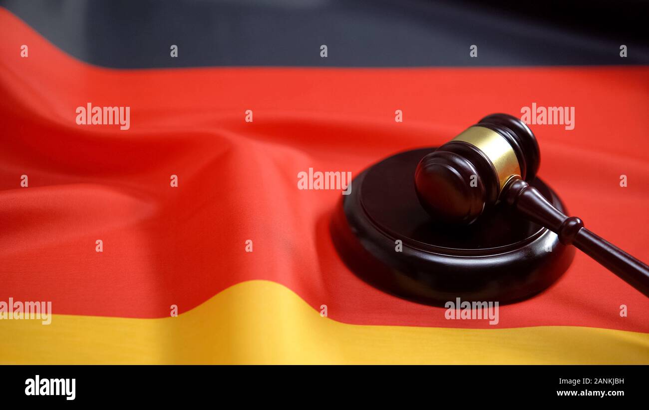 Gavel lying on sound block against german flag, national legal system, law Stock Photo