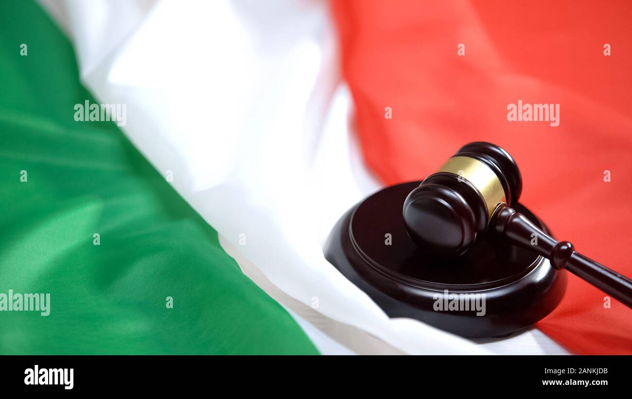 Gavel striking on sound block against italian flag, ministry justice, authority Stock Photo