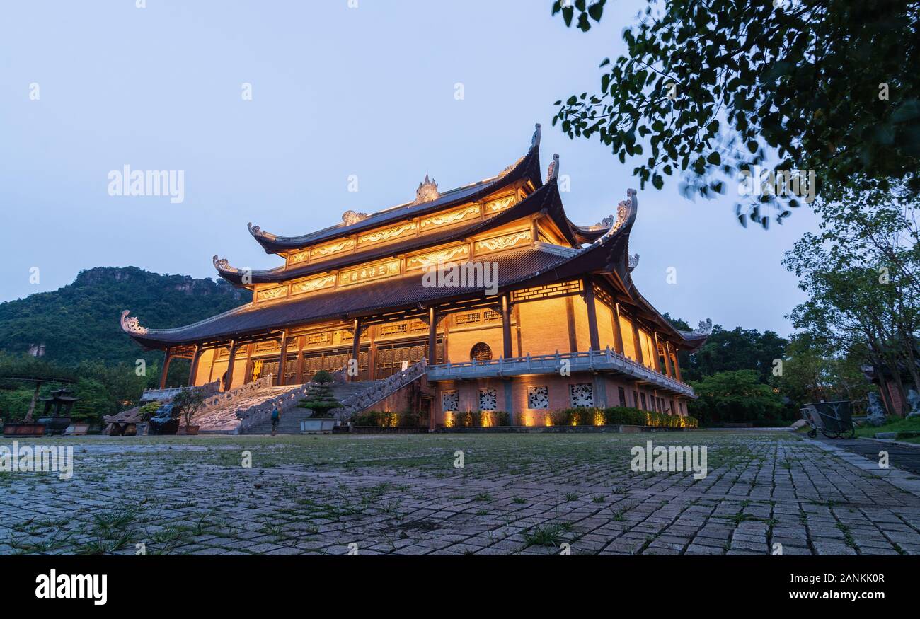 Ninh Binh, Vietnam - May 2019: sunset view over The Buddhas of The Three Times Hall at night Stock Photo
