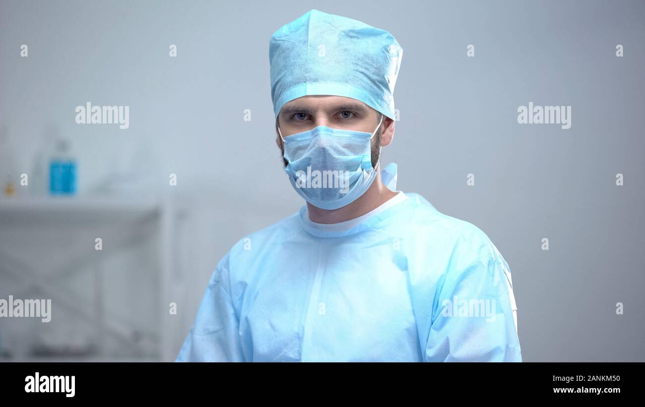 Professional surgeon medical face mask looking at camera, after operation Stock Photo