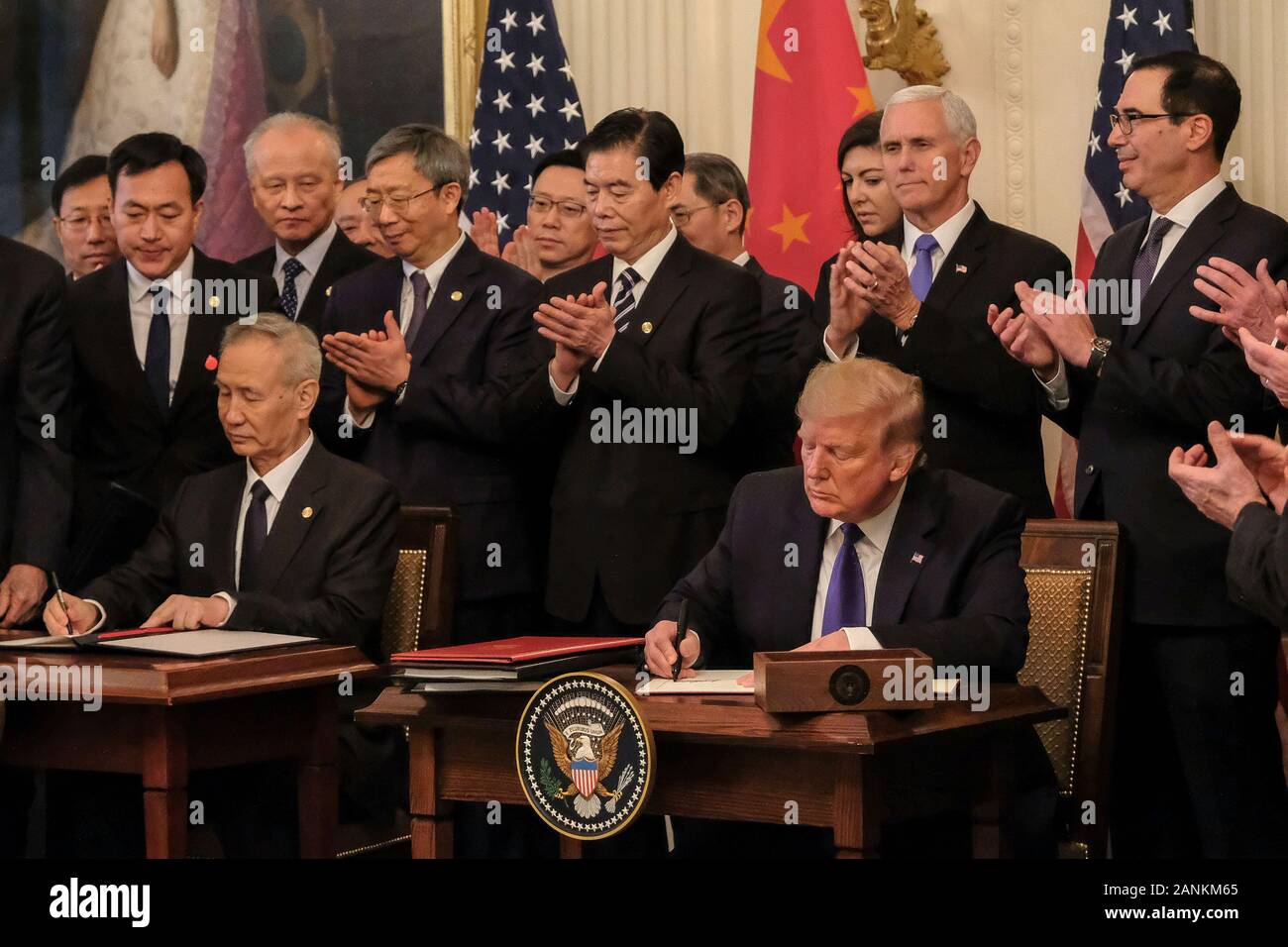 President Donald Trump and Chinese Vice Premier Liu He are applauded after signing the Phase 1 trade deal between the United States and China, during a ceremony in the East Room at the White House on Wednesday, January 15, 2020. The Phase 1 deal will cancel upcoming planned tariffs on Chinese-made products and reduces others while Chine has agreed to increase purchases of U.S. farm products and other goods. Credit: Alex Wroblewski/Pool via CNP /MediaPunch Stock Photo