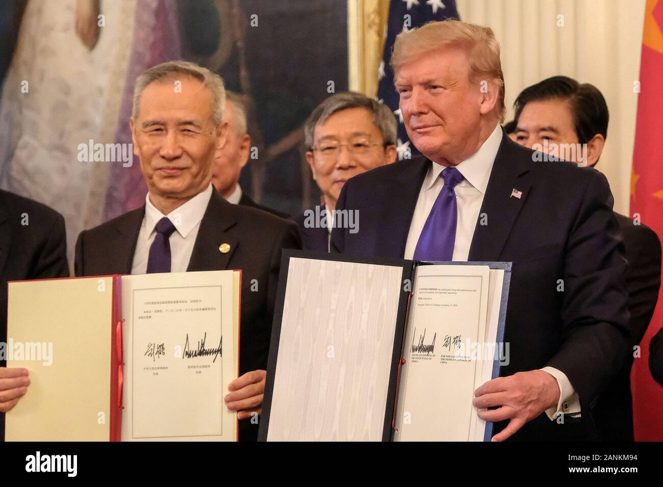 President Donald Trump and Chinese Vice Premier Liu He are applauded after signing the Phase 1 trade deal between the United States and China, during a ceremony in the East Room at the White House on Wednesday, January 15, 2020. The Phase 1 deal will cancel upcoming planned tariffs on Chinese-made products and reduces others while Chine has agreed to increase purchases of U.S. farm products and other goods. Credit: Alex Wroblewski/Pool via CNP /MediaPunch Stock Photo