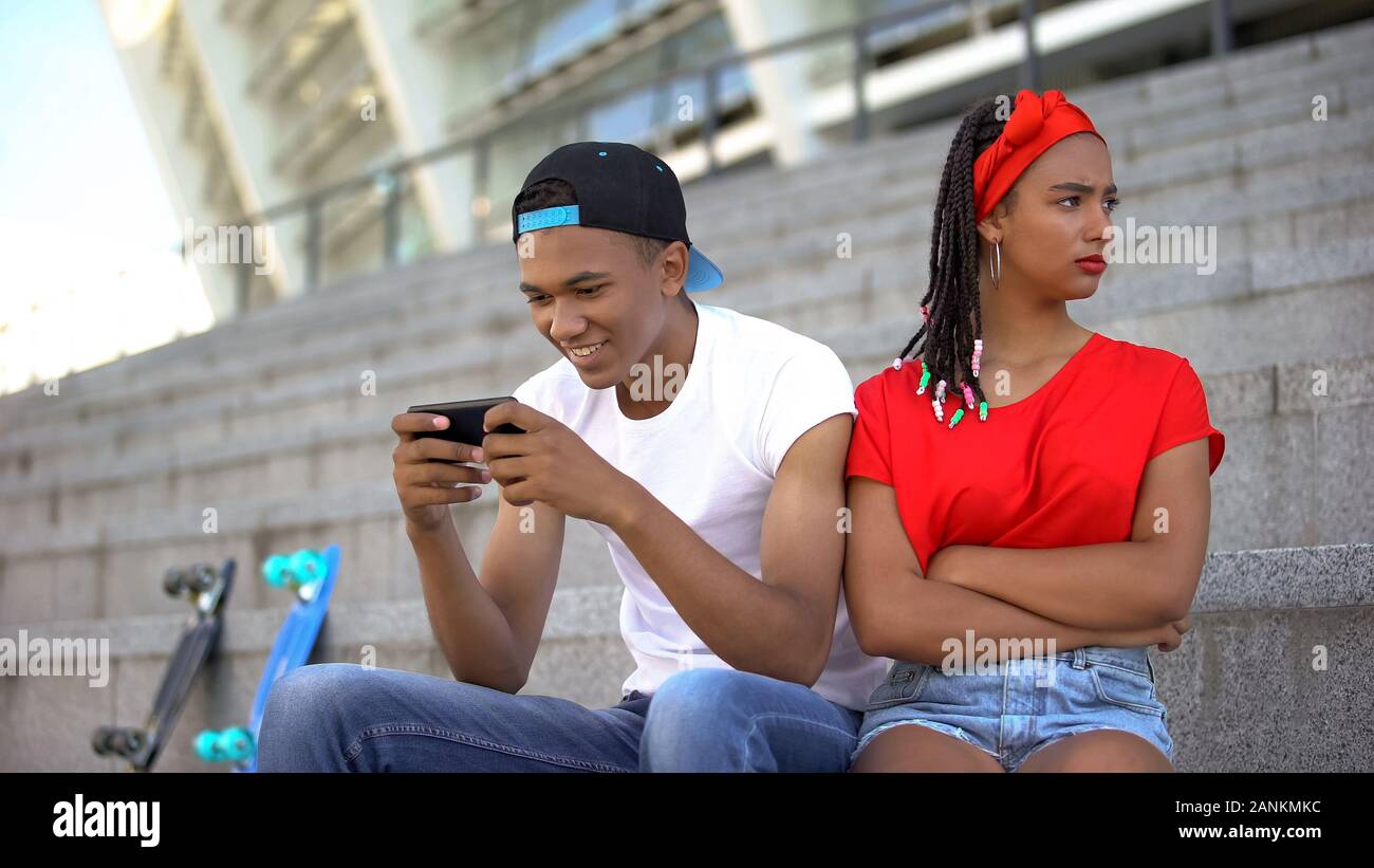 Boring Date. Excited Black Guy Playing Video Games and Ignoring Girlfriend  Next To Him Stock Image - Image of enjoy, conflict: 188745699