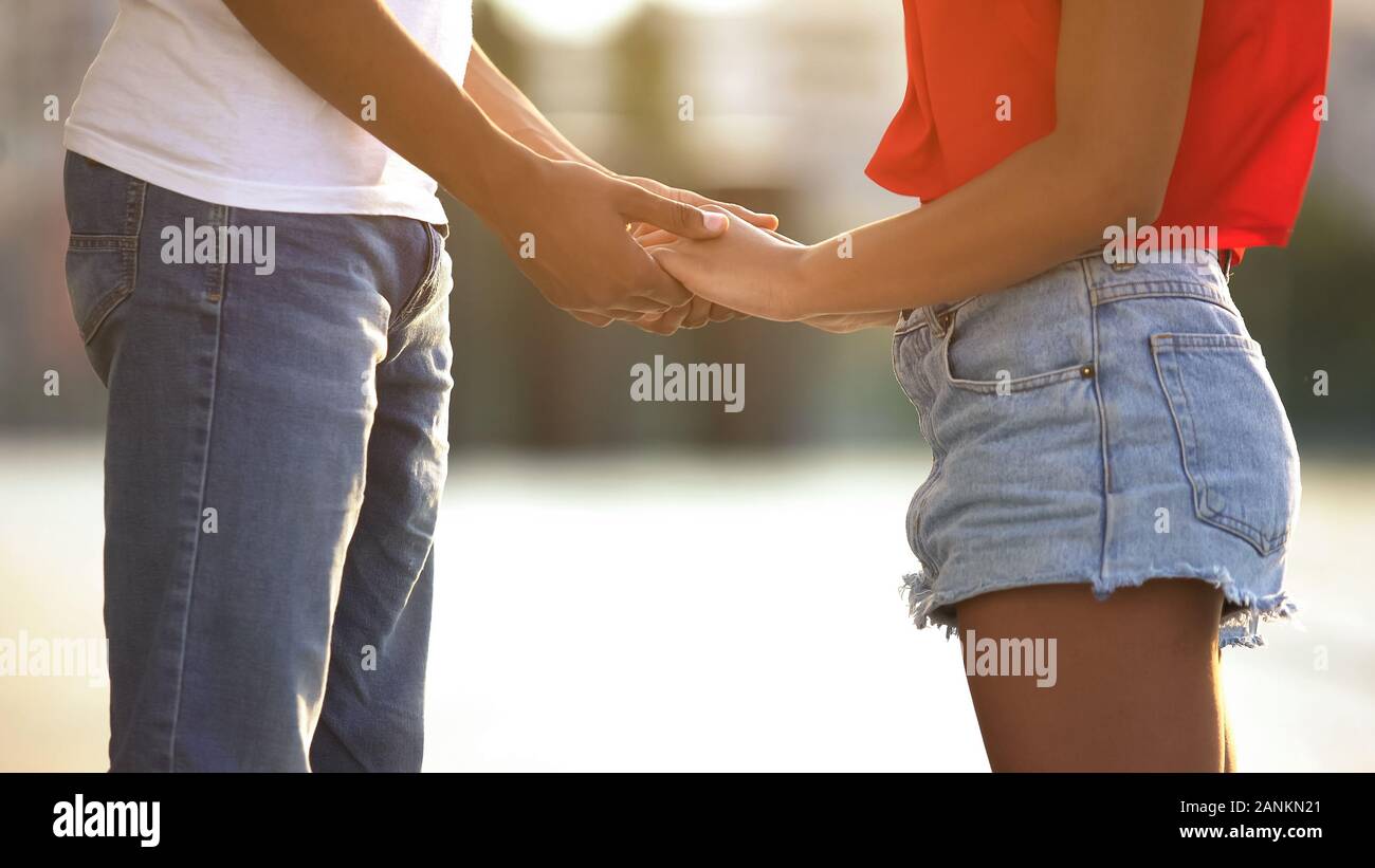 Teen couple holding hands close up hi-res stock photography and images ...