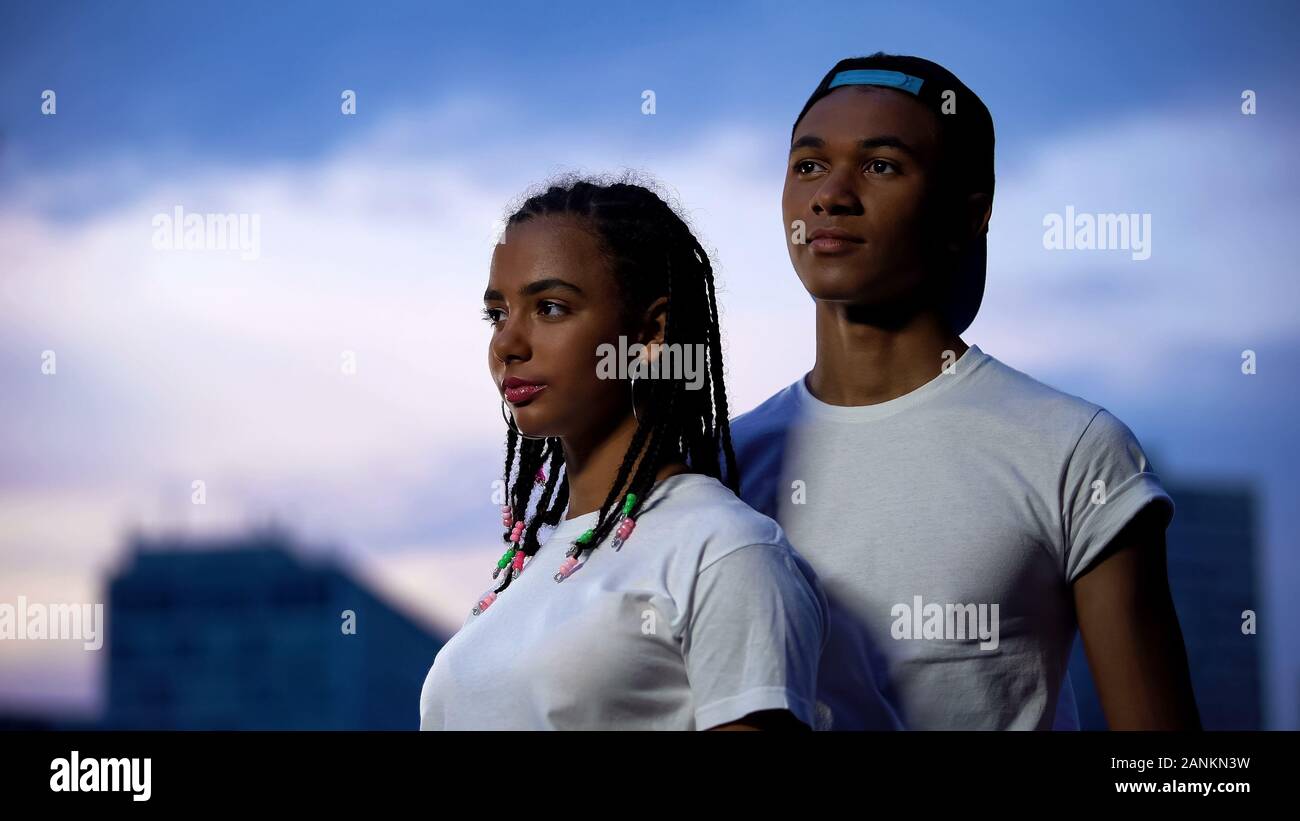 Teenagers couple in white T-shirts 