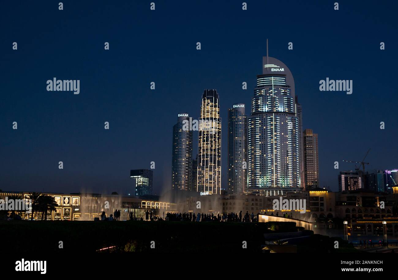 People enjoying the Dubai Fountain show at night Downtown Dubai