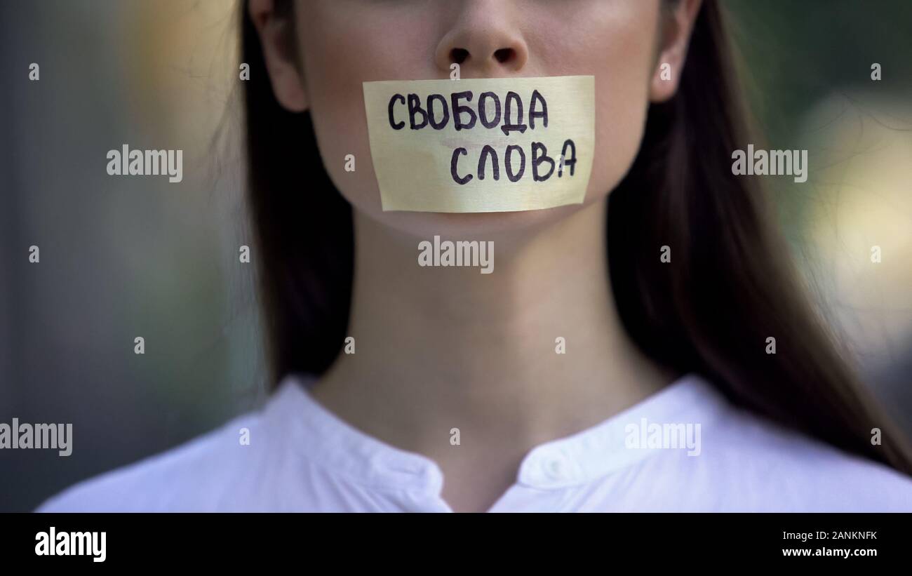Freedom of speech phrase in russian on female taped mouth, democracy concept Stock Photo