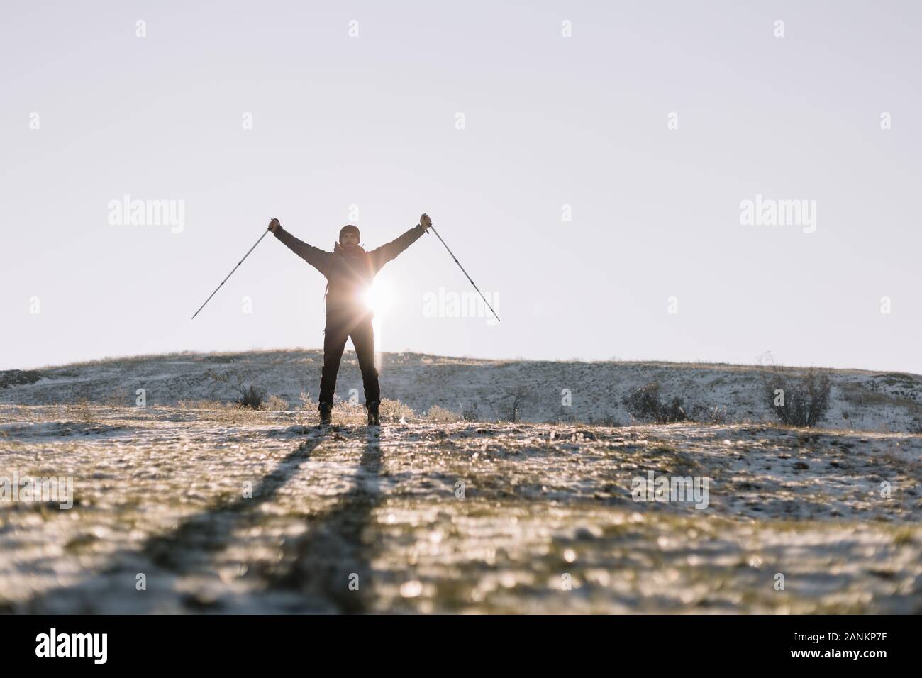Man's silhouette in front of a sun Stock Photo - Alamy