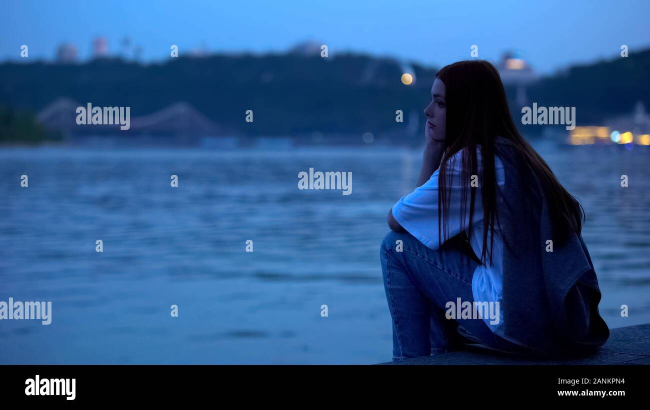 Upset girl sitting on river hi-res stock photography and images - Alamy