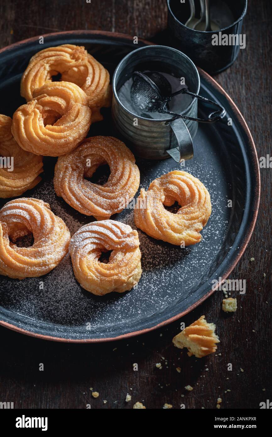Hot and sweet spanish donuts with powdered sugar Stock Photo Alamy