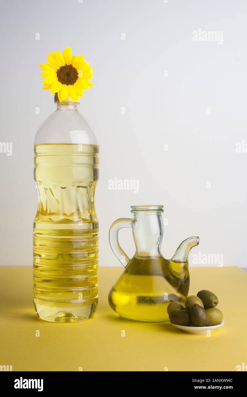 Bottle of sunflower oil and jug of olive oil Stock Photo Alamy
