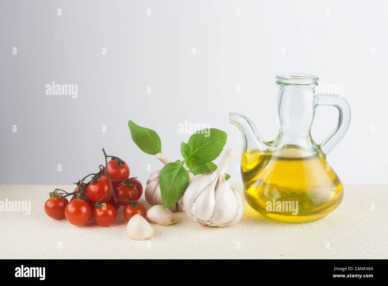 Olive oil, basil, garlic and tomato Stock Photo - Alamy