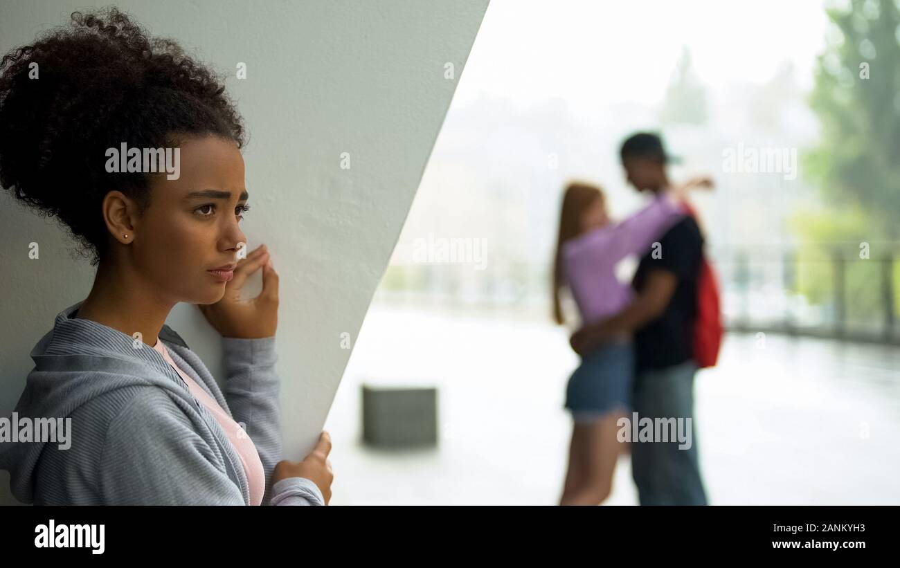 Sad female teenager upset because of boyfriends betrayal, broken-hearted girl Stock Photo